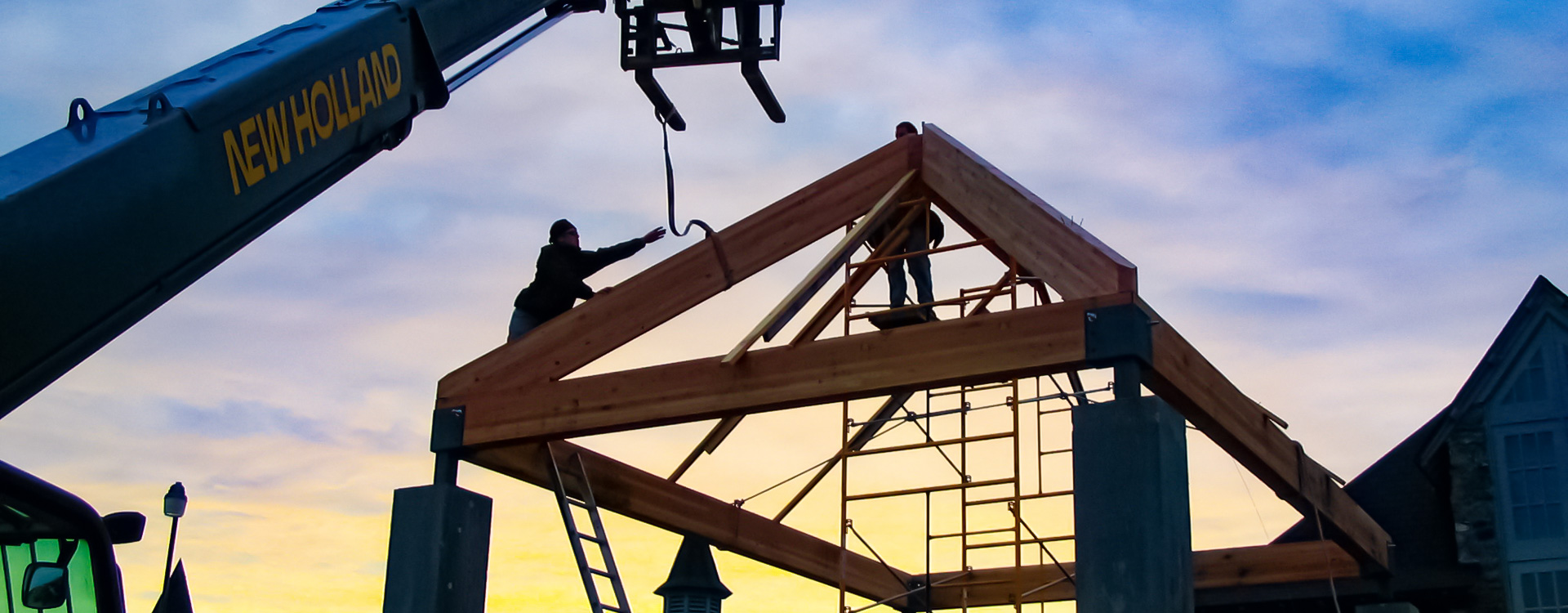 timber frame construction at sunset